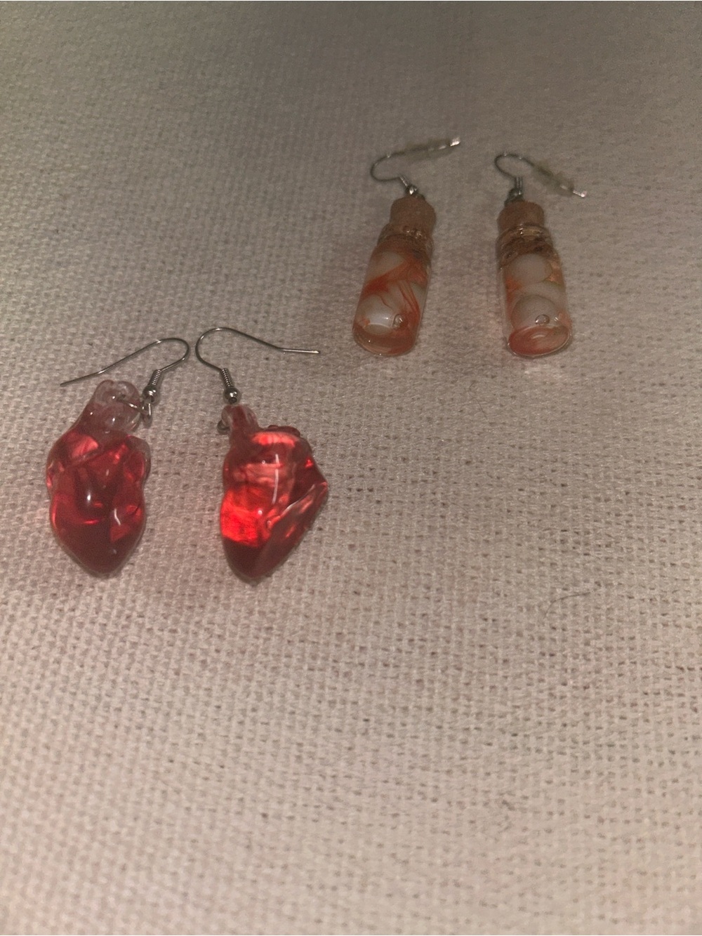 2 pairs of earrings. Anatomical heart & white and orange jarred eyeballs